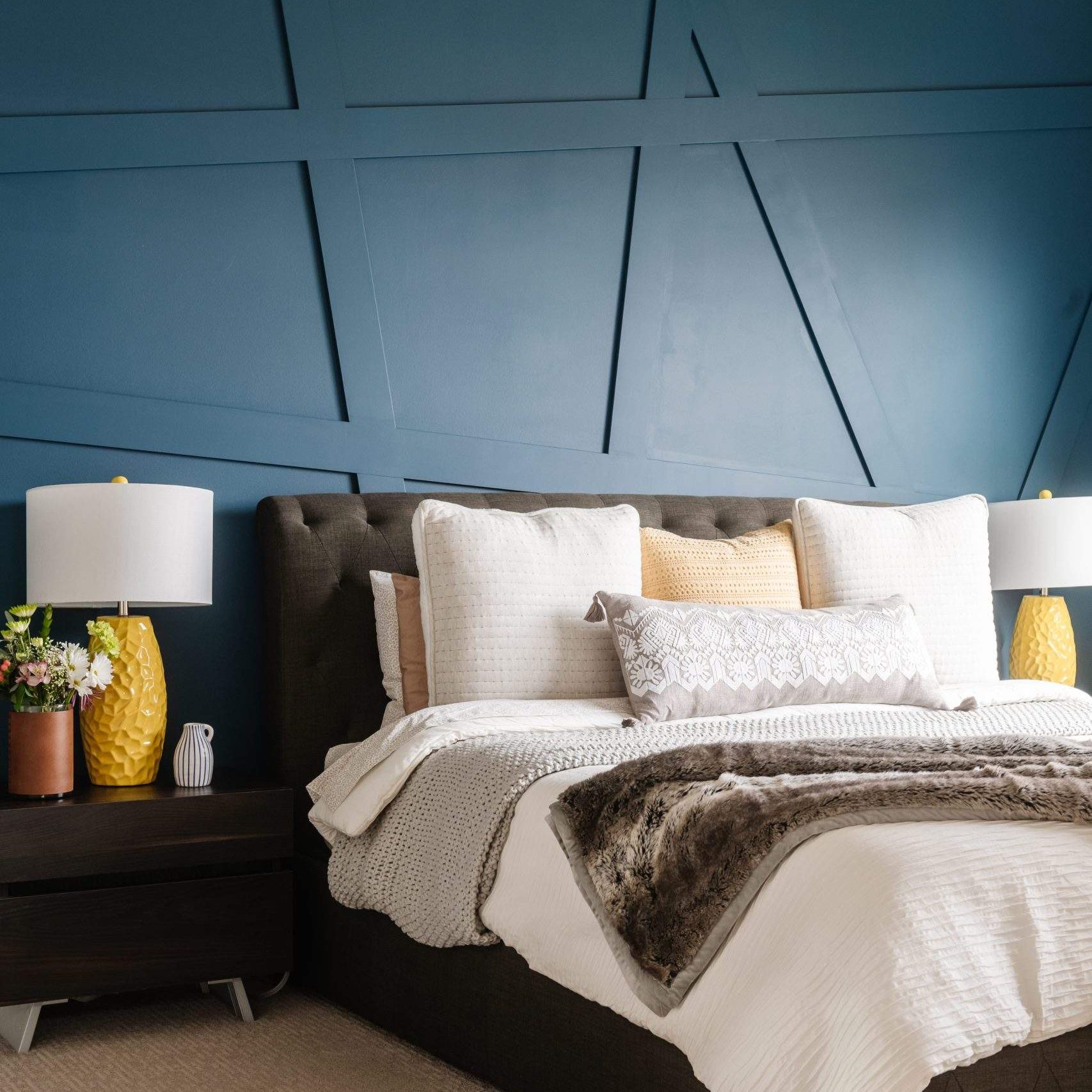 Etch Design Group in Austin, Texas - custom home designed to be comfortable and polished to make a bold statement - bedroom with blue textured wall.