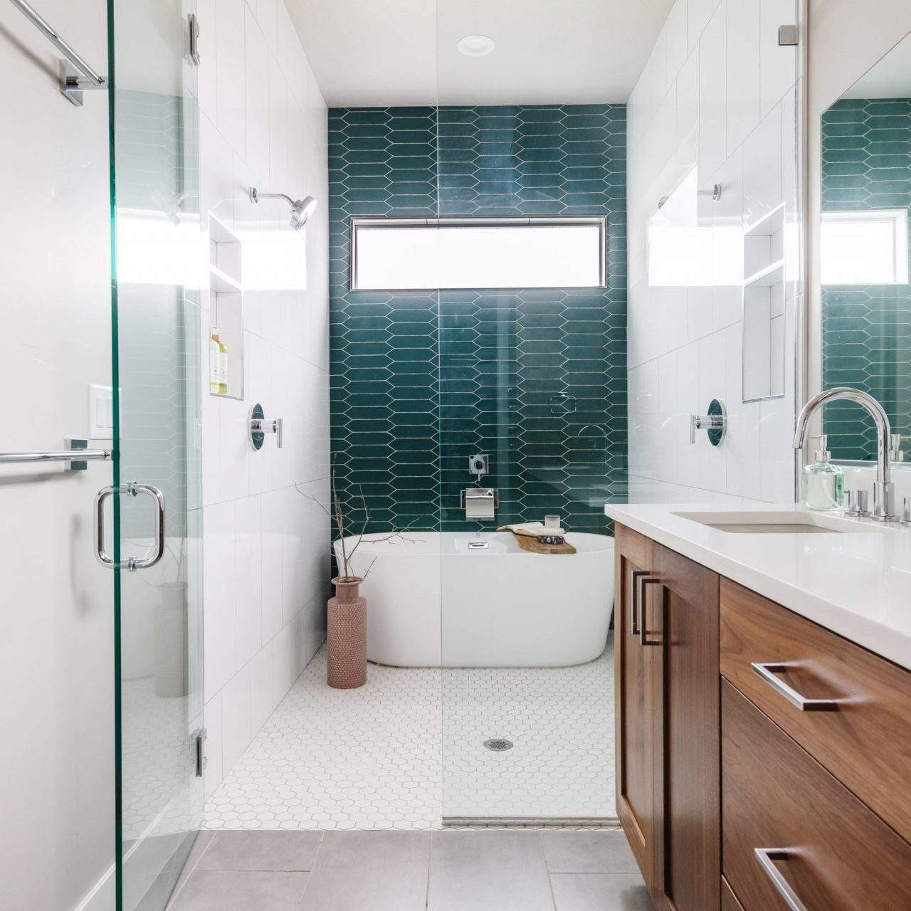 Etch Design Group in Austin, Texas - custom home designed to be comfortable and polished to make a bold statement - bathroom with dramatic tile selection behind tub.